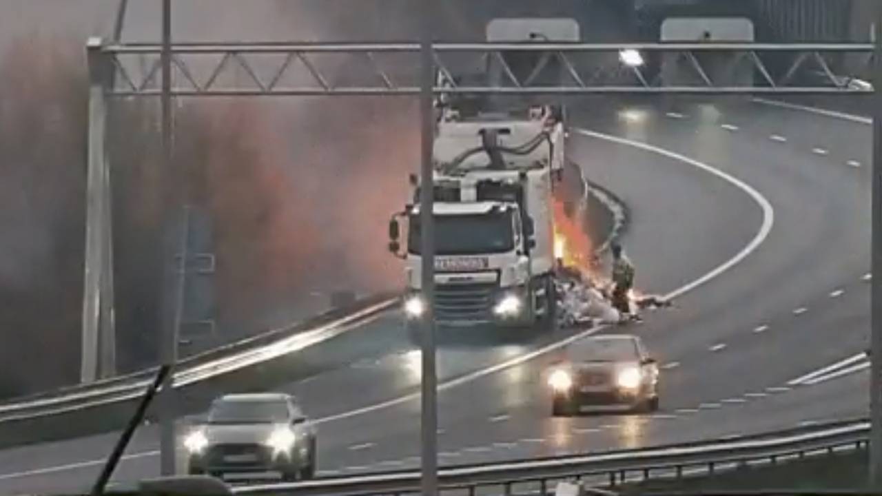 Crowded morning rush hour with traffic jams in Brabant: garbage trucks on fire