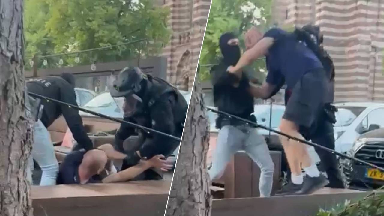 Een man wordt op een vol terras tegen de grond gewerkt.