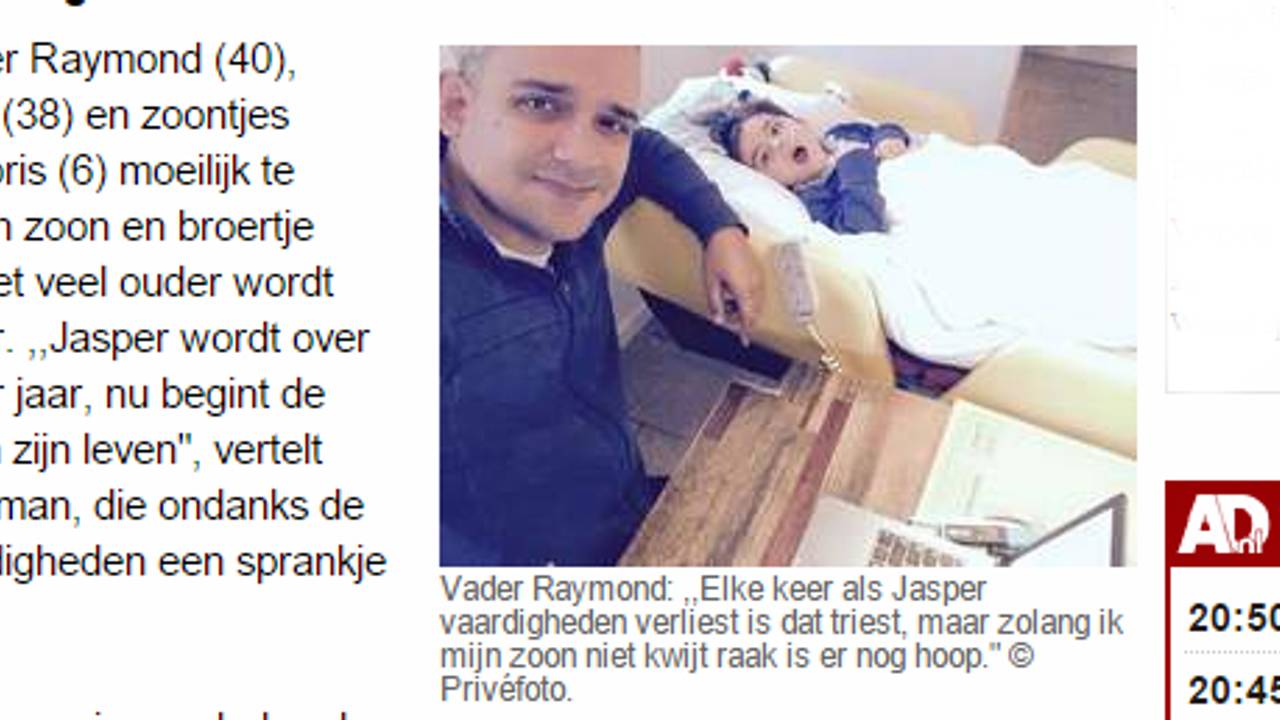 Vader Raymond en zoontje Jasper in het AD. (beeld: AD.nl)