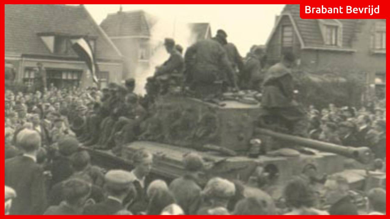 Churchilltank met daarop Duitse krijgsgevangenen trekt door Oss. | Foto: L. v.d. Bergh