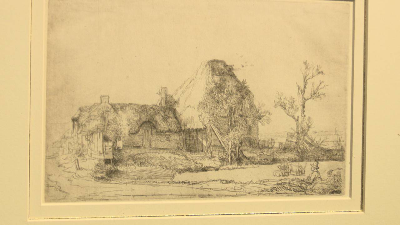 De ets ‘Landschap met kunstenaar’