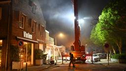 Brand in huis, bewoners vluchten over dakterras