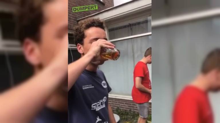 De jongen met een goudvis in zijn bier. (Foto: Dumpert)