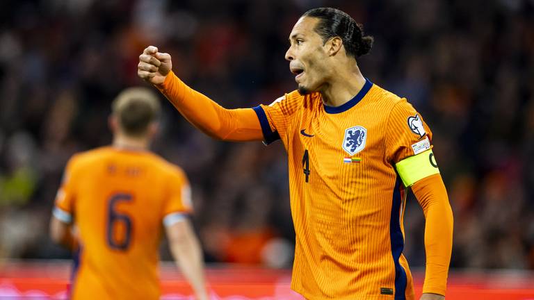 Virgil van Dijk: blij met het record, de zege en de plaatsing voor het WK (foto: ANP).