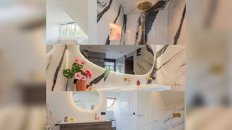 De badkamers in de villa hebben marmeren muren (foto: Van Liessum Makelaars).