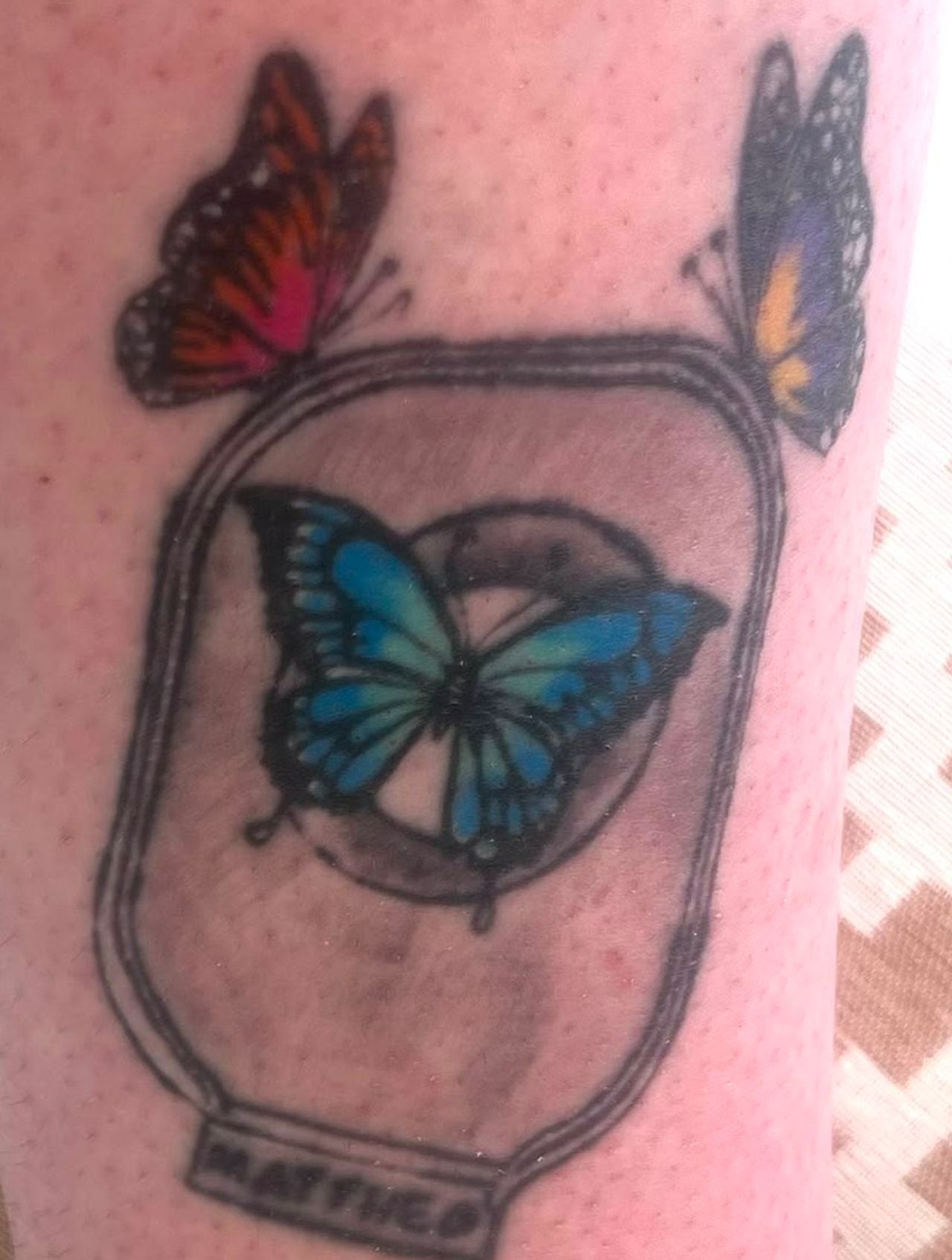 Tattoo van Marit, het stomazakje en de vlinders van Mattheo