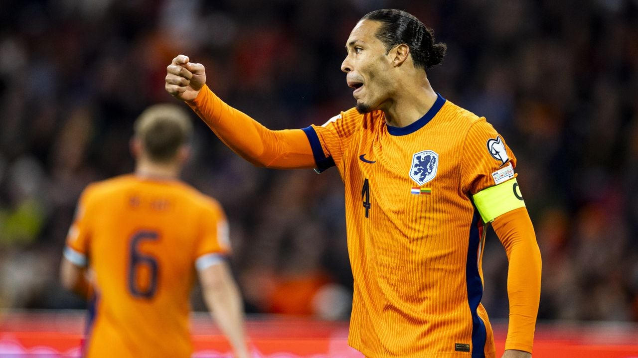 Virgil van Dijk: blij met het record, de zege en de plaatsing voor het WK (foto: ANP).