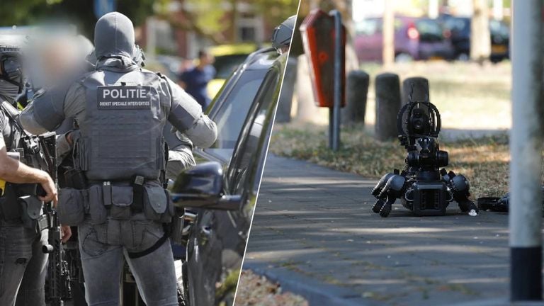 Links: Een lid van het DSI-team, Rechts: de robothond (Foto: Christian Traets / Persbureau Heitink).